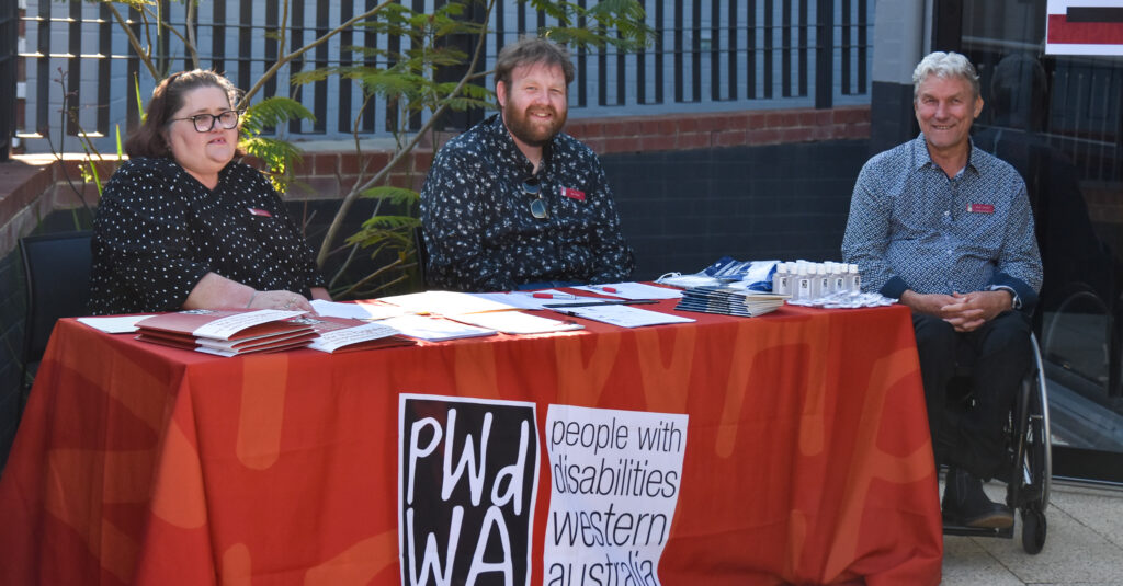 PWdWa advocates Lisa, Joe and Mark at registration table.